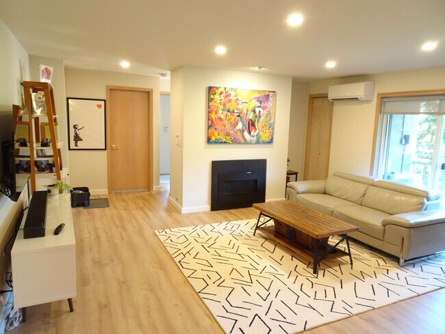 Building Photo - Modern Urban Living with Stunning Views at...