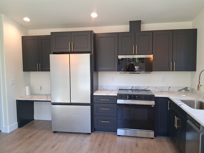 Building Photo - Stylish Newly Built One-bedroom in the Hea...