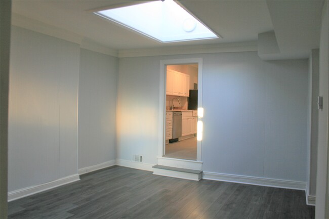 Living room with giant skylight - 1732 Bolton St