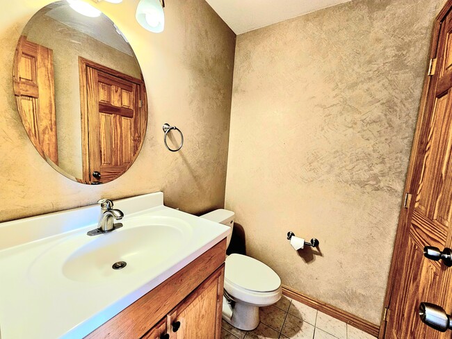 Downstairs half bath showing textured custom paint - 3724 Quail St