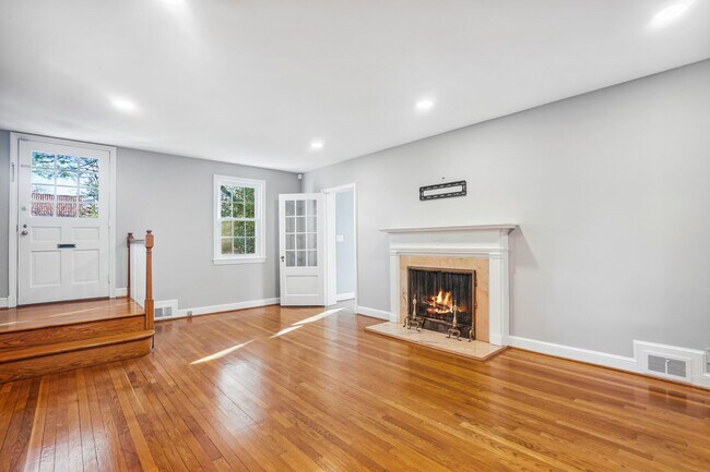Living Room with wood burning fireplace - 7400 Connecticut Ave