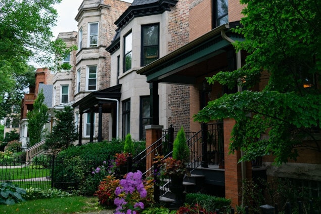Houses line a quiet, residential street