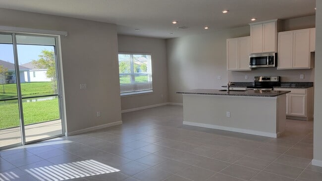 Building Photo - Annual UNfurnished NEW 4/ 2 1/2 home off S...
