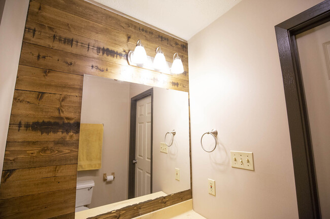 Hand-stained pine board accent wall - 842 Stewart St