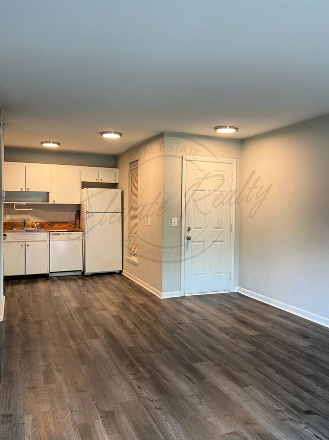 Building Photo - One Bedroom Condo, FIRST FLOOR, Assigned P...