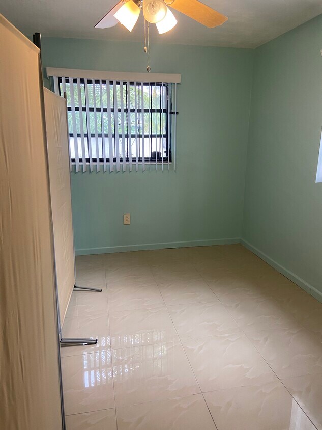 This is the room with a divider from the kitchen area - 255 NE 164th Ter