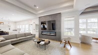 This contemporary 1550 square foot space showcases a harmonious blend of style and functionality. The open floor plan seamlessly integrates the living room and kitchen, creating a fluid, airy atmosphere. The living area is characterized by its expansive layout, featuring a sleek sectional sofa and vibrant accent chairs that add pops of color to the neutral palette.

High ceilings and recessed lighting contribute to the sense of spaciousness, while large windows flood the area with natural light and offer picturesque views. A standout feature is the modern linear fireplace, framed by a striking concrete surround, serving as both a focal point and a source of warmth.

The gourmet kitchen boasts a generous island with a waterfall countertop, providing ample space for food preparation and casual dining. Dark cabinetry contrasts beautifully with light countertops and backsplash, while high-end stainless steel appliances complete the chef-inspired space. Pendant lighting adds a touch of elegance and task lighting over the island.

Throughout the space, warm wood flooring creates a cohesive look, complemented by carefully chosen area rugs that define different zones. The overall design aesthetic is clean and minimalist, with thoughtfully curated decor pieces that add personality without cluttering the space.