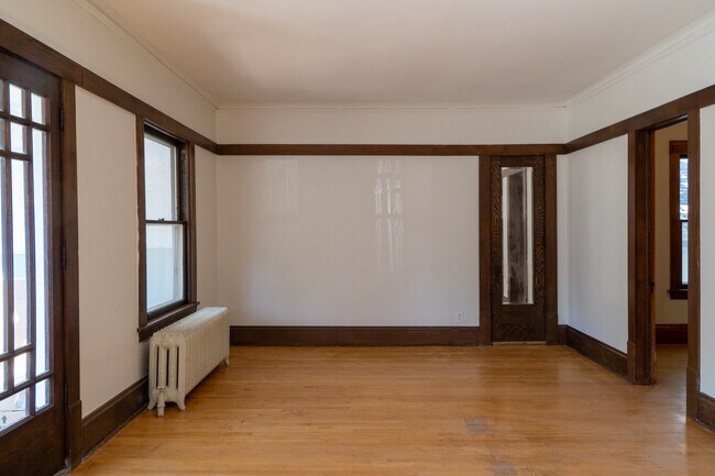 Living room w/ additional space in view - 4031 Blaisdell Ave