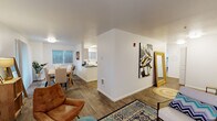 Located at 621 SE 168th Ave in Vancouver, Washington, this single-floor apartment offers a thoughtfully designed layout with an open-concept living and dining area that flows seamlessly through the space. The living room is bright and welcoming, featuring wood-look flooring, a textured ceiling, and a large window that invites natural light. The dining area is generously sized, accommodating a full dining table and chairs, with a sliding glass door providing outdoor access and additional natural light.

The kitchen is outfitted with crisp white cabinetry, dark countertops, and stainless steel appliances including a refrigerator and electric range, combining function with a clean, modern aesthetic. Wood-look flooring continues throughout the main living areas, creating a cohesive feel.

The bedroom is carpeted for comfort and includes a sliding closet for ample storage, along with a window that brightens the room naturally. Two bathrooms serve the unit — one full bathroom featuring wood-look flooring, a vanity with dark countertop, and a tub/shower combo, and a second bathroom with a more compact layout. Clean white walls and consistent finishes throughout the unit contribute to a fresh, move-in-ready atmosphere.