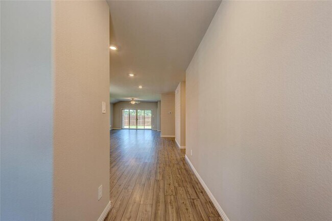 Hall featuring light wood-style floors - 1109 Birchwood Ln