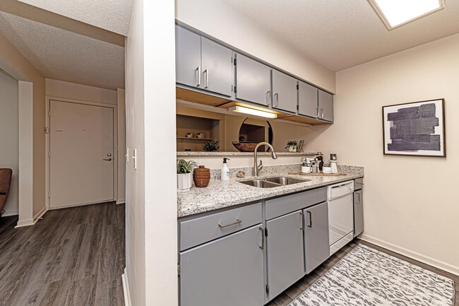 Kitchen with granite counters and hardwood-style flooring - The Manning