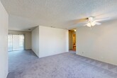 Located at 7511 N 1st St in Fresno, CA, this single-story, 2-bedroom, 3-bathroom home offers a functional and comfortable layout. The open living room features soft carpeting, a ceiling fan, a textured ceiling, and sliding door access that brings in natural light. The kitchen is equipped with warm oak cabinetry, a double-basin sink, a white electric range, and a dishwasher, all brightened by a large window with outdoor views of surrounding greenery. The spacious primary bedroom includes plush carpet, a generous window, and an en-suite bathroom featuring a dual-sink vanity with oak cabinetry, large mirrors, and Hollywood-style lighting. The second bedroom offers carpeted floors, a closet with sliding doors, and a window that fills the room with natural light. A dedicated laundry room provides overhead cabinetry and tile flooring, offering added storage and utility. Three bathrooms throughout the home ensure ample convenience for residents and guests alike. Connected by a central hallway, the layout is practical and well-organized, making efficient use of the overall floor area. The home presents a neutral, clean aesthetic throughout, ready to accommodate a variety of personal styles.