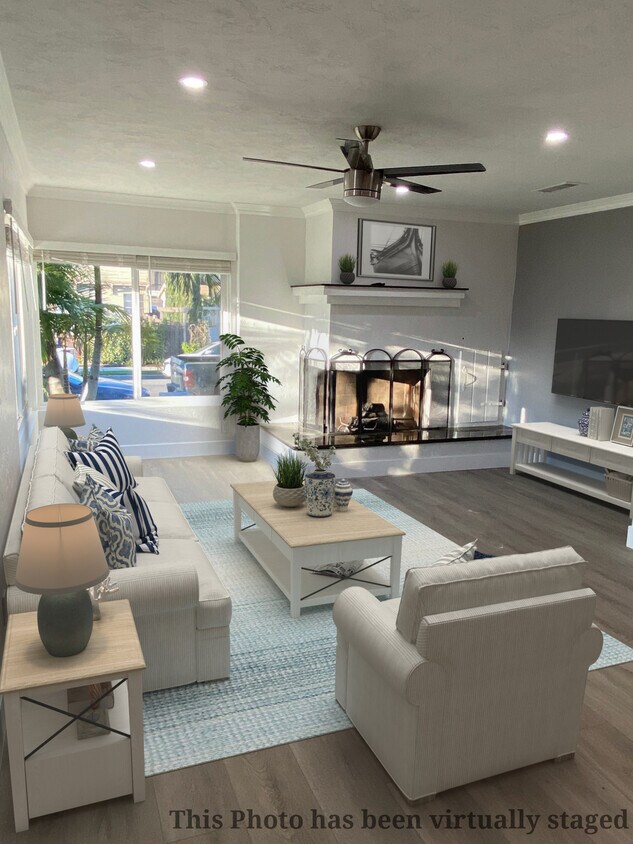 Open living room with working fireplace - 4885 Normandie Pl