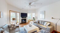 Located at 625 Shepherd Ct in Brookfield, Wisconsin, this well-appointed 2-bedroom, 3-bathroom single-floor residence offers a thoughtfully designed open-concept layout. The bright living room serves as the heart of the home, featuring hardwood floors, a ceiling fan, a corner fireplace, and sliding glass doors that invite natural light and outdoor views. An adjacent sitting area flows seamlessly into the space, enhancing its versatility.

The kitchen is equipped with warm oak cabinetry, recessed lighting, and a generous granite-topped island with bar seating — ideal for casual dining. The connected dining room offers a dedicated space for formal meals, complete with a modern pendant light fixture.

The spacious primary bedroom provides a comfortable retreat with plush carpeting and ample closet storage. Its en-suite bathroom is a standout, featuring a soaking tub, dual vanity, tile flooring, and an adjoining private water closet. The second bedroom benefits from a large window with natural light, making it suitable as a guest room or home office. Three closets throughout the home ensure abundant storage. The clean, neutral palette and warm wood accents give the entire space a cohesive, welcoming ambiance.