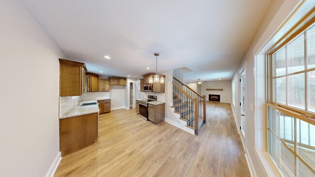Building Photo - Beautifully Upgraded Home | Stone Fireplace, Open Kitchen and Two-Car Garage