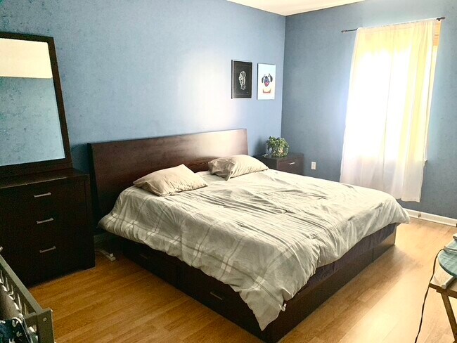 Master Bedroom (California King size bed pictured) - 372 Bramhall Ave
