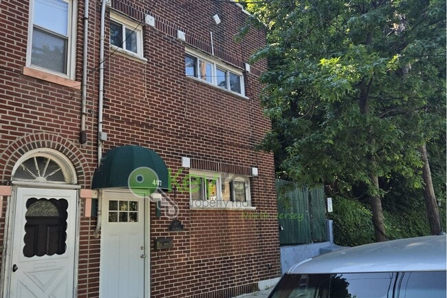 Photo - Rare Renovated 3BR/2BA Townhouse with Private Yard & NYC Views