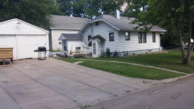 Rear entry of house offers walkout basement and entry into home. - 2024 Central Ave