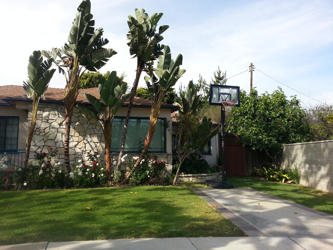 Front of house with stone facade and large windows - 2624 S Westgate Ave