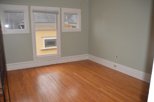 bedroom with ceiling fan and large closet - 558 Madison Ave SE