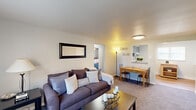 Located at 3 Marhoefer Dr in Pleasant Hills, PA, this well-maintained 2-bedroom, 1-bathroom residence offers a thoughtfully arranged single-floor layout designed for comfortable everyday living. The inviting living room features plush carpeting, neutral walls, and a bright window dressed with sheer curtains that allows natural light to fill the space. A pass-through opening connects the living area to the kitchen, creating an open and sociable atmosphere. The kitchen is equipped with sage-green cabinetry, light countertops, a gas range, dishwasher, and hardwood-style flooring, giving it a clean and functional character. Both bedrooms are carpeted and outfitted with ceiling fans, offering a cozy retreat. The spacious primary bedroom includes a double-door closet, while the second bedroom features a window with natural light and a closet as well. The bathroom is finished with classic white subway tile surrounding a tub-shower combination, accented by a window for natural ventilation. A connecting hallway ties all rooms together efficiently. Throughout the residence, the soft color palette and practical finishes create a calm, livable ambiance suited for individuals or small families.