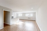 Located at 2622 Swede Road in East Norriton Township, PA, this 2-bedroom, 1-bathroom single-floor unit offers a clean, modern living experience with a bright, neutral palette throughout. The open-concept living and dining area is highlighted by light wood-look luxury vinyl flooring, recessed lighting, and multiple windows that invite generous natural light. A wall-unit air conditioner and baseboard heating provide year-round comfort.

The kitchen is well-appointed with white shaker-style cabinetry, a classic subway tile backsplash, stainless steel appliances including a range, microwave, and refrigerator, and a dedicated dining nook with an exterior-facing window. A practical peninsula separates the kitchen from the living space.

Both bedrooms feature plush carpeting and neutral-toned walls, with the primary bedroom offering two windows and a wall-unit air conditioner. Three closets provide ample storage throughout the unit. The full bathroom includes wood-look flooring, a white vanity, and clean, simple finishes. A dedicated laundry area adds everyday convenience. A hallway connects all rooms cohesively, completing this efficiently designed and move-in-ready home.