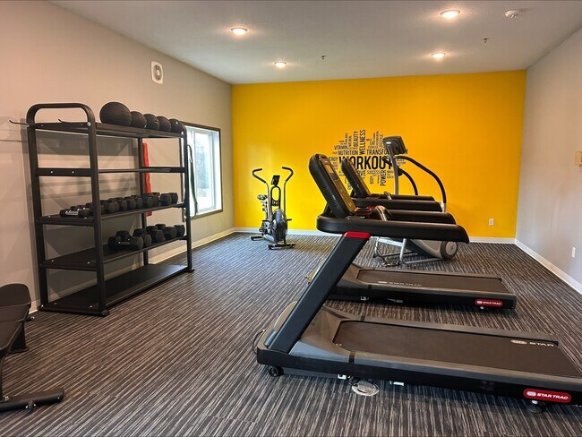 A well-equipped fitness center that makes it easy to stay active on your own schedule. - The Quarters