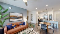 This thoughtfully designed 2-bedroom, 2-bathroom residence at 6302 Greenbelt Pky in Garland, TX offers a functional and modern living experience across a single floor. The open-concept layout seamlessly connects the kitchen, dining, and living areas, creating an inviting and spacious feel. The kitchen is a standout feature, showcasing a granite-topped island with a built-in sink and dishwasher, dual pendant lights, two-tone cabinetry with gray lower and white upper cabinets, a subway tile backsplash, and stainless steel appliances including a French door refrigerator. The living room benefits from large windows that bring in generous natural light, a ceiling fan, and a striking blue accent wall. Durable wood-style flooring flows throughout the main areas, complementing the contemporary aesthetic. The primary bedroom offers a comfortable retreat with plush carpet, a ceiling fan, and a large window with outdoor views. Its en-suite bathroom features granite countertops, a soaking tub with tile surround, and direct access to a well-organized walk-in closet with built-in shelving. A second bedroom and closet provide flexible living options. Recessed lighting throughout adds to the clean, modern ambiance of this well-crafted residence.