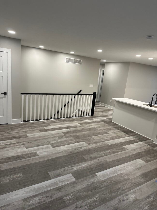 Living room leading to hallway and kitchen. - 1622 Gunnison Rd