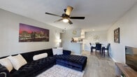 Located at 305 W Baker Rd in Baytown, TX, this one-bedroom, one-bathroom unit offers a well-designed single-floor layout that maximizes its compact footprint. The open-concept living area is anchored by wood-look flooring that flows throughout the home, and a ceiling fan overhead provides both comfort and light. A window near the entryway brings in natural light, creating a bright and welcoming atmosphere.

The living space transitions seamlessly into the dining area and kitchen, which features white cabinetry, a double-basin sink, ample counter space, and a pantry for additional storage. A breakfast bar-style partition separates the kitchen from the main living and dining areas, adding a sense of openness while defining each zone.

The bedroom is a comfortable, well-proportioned retreat with a window that allows in natural light and direct access to a dedicated closet. A second closet provides additional storage elsewhere in the unit. The bathroom is clean and functional, featuring a full tub-shower combination with tile surround and wood-look flooring.

Throughout the unit, neutral gray walls, consistent flooring, and a straightforward layout contribute to a cohesive and practical living environment well-suited for individuals or couples.