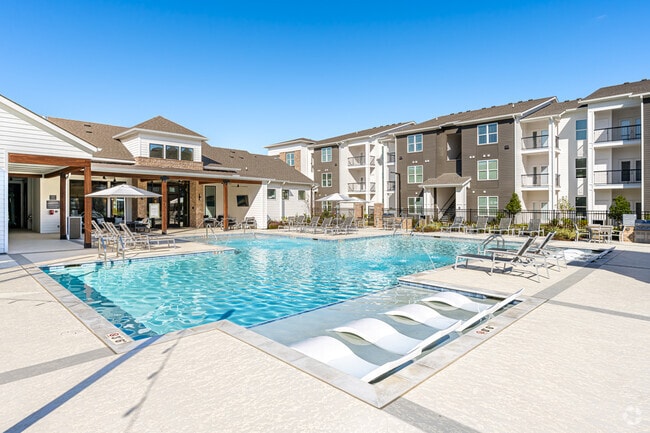 Resort-Style Pool with Baja Tanning Shelf - The Waters at Bluebonnet
