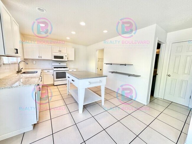 Building Photo - Gorgeous 4BR Home with Granite Counters, Open-Concept Living & 2 car garage