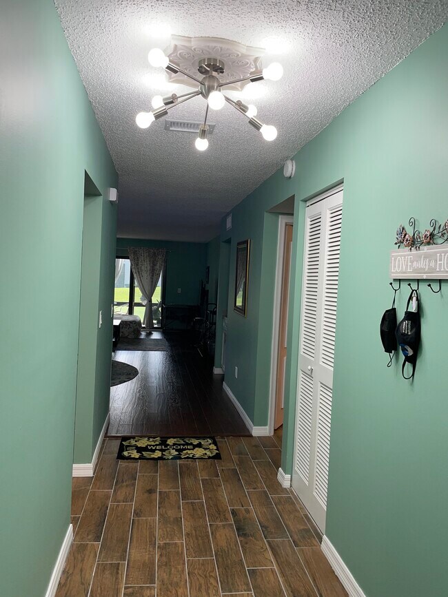 Living and dining overlooking patio - 21820 Cypress Cir