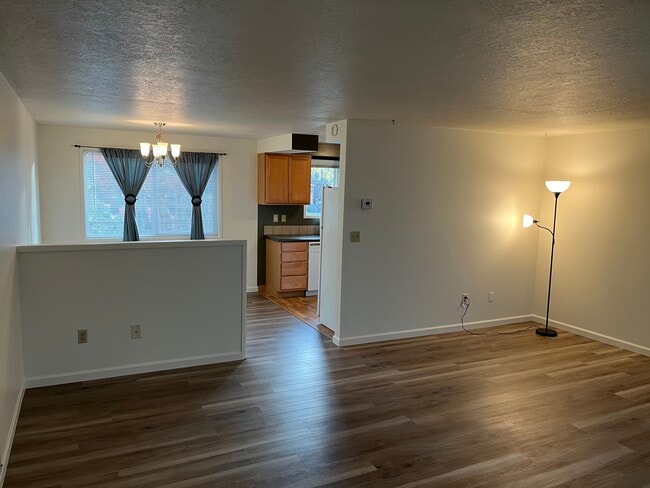From living room looking into dining room and kitchen. - 1138 NE 72nd Ave