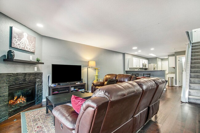 Building Photo - End Unit Townhome with Large Patio and Amb...