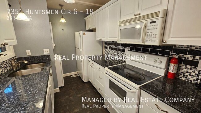 Building Photo - Third Story Two Bedroom Condo with Garage ...