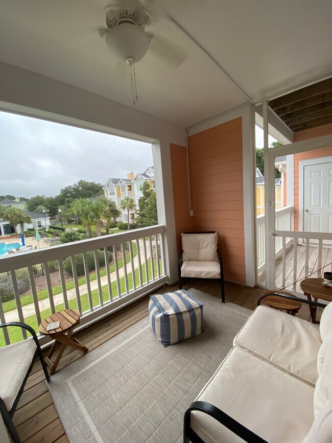 Screened in porch leading to outdoor balcony and storage closet - 1123 Rosewood Ln