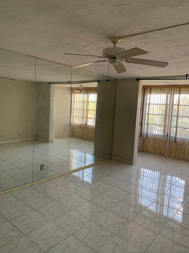 Living room, dining room and patio area with tile flooring - 2821 Somerset Dr
