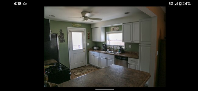 Kitchen with stainless steel appliances. - 106 W North St