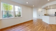 Located at 334 S Fremont St. in San Mateo, CA, this single-story, 3-bedroom, 1-bathroom home offers a clean, modern aesthetic throughout. Warm hardwood flooring flows seamlessly across every room, complemented by crisp white walls and recessed lighting that create a bright, welcoming atmosphere.

The combined kitchen and living area serves as the heart of the home. The kitchen is well-appointed with white shaker cabinetry, granite countertops, a stainless steel gas range, over-the-range microwave, dishwasher, and a French-door refrigerator, offering ample storage and counter space for everyday living.

Three bedrooms provide comfortable and versatile living arrangements. The primary bedroom is generously sized, while the additional bedrooms offer good natural light through large windows with views of surrounding greenery. One bedroom features a double sliding-door closet for added storage convenience.

The bathroom is finished with granite countertops, white cabinetry, a full tub-shower with tiled surround, and a large vanity mirror. A dedicated laundry area with in-unit washer hookups adds practical everyday convenience. A hallway connects the rooms efficiently, and direct outdoor access through the living area opens to a private exterior space, enhancing the overall sense of openness.