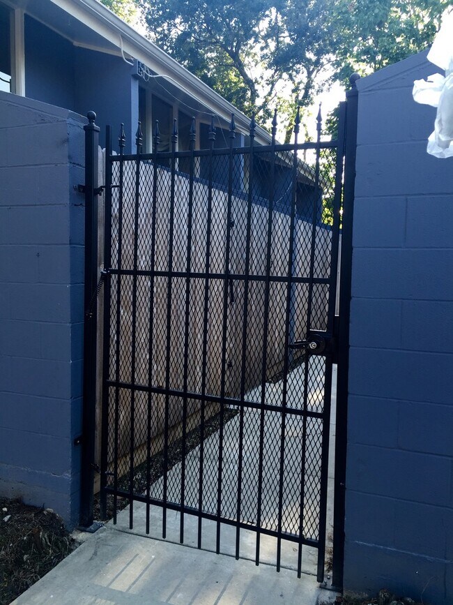 Locked iron gate - 3350 Tula St