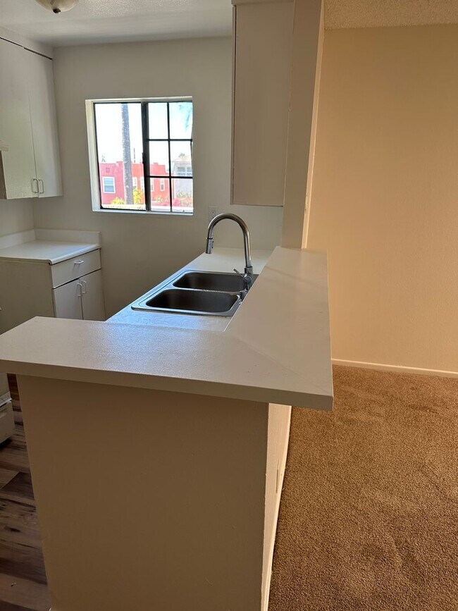 Building Photo - 2-Bedroom First-Floor Condo with Utilities...