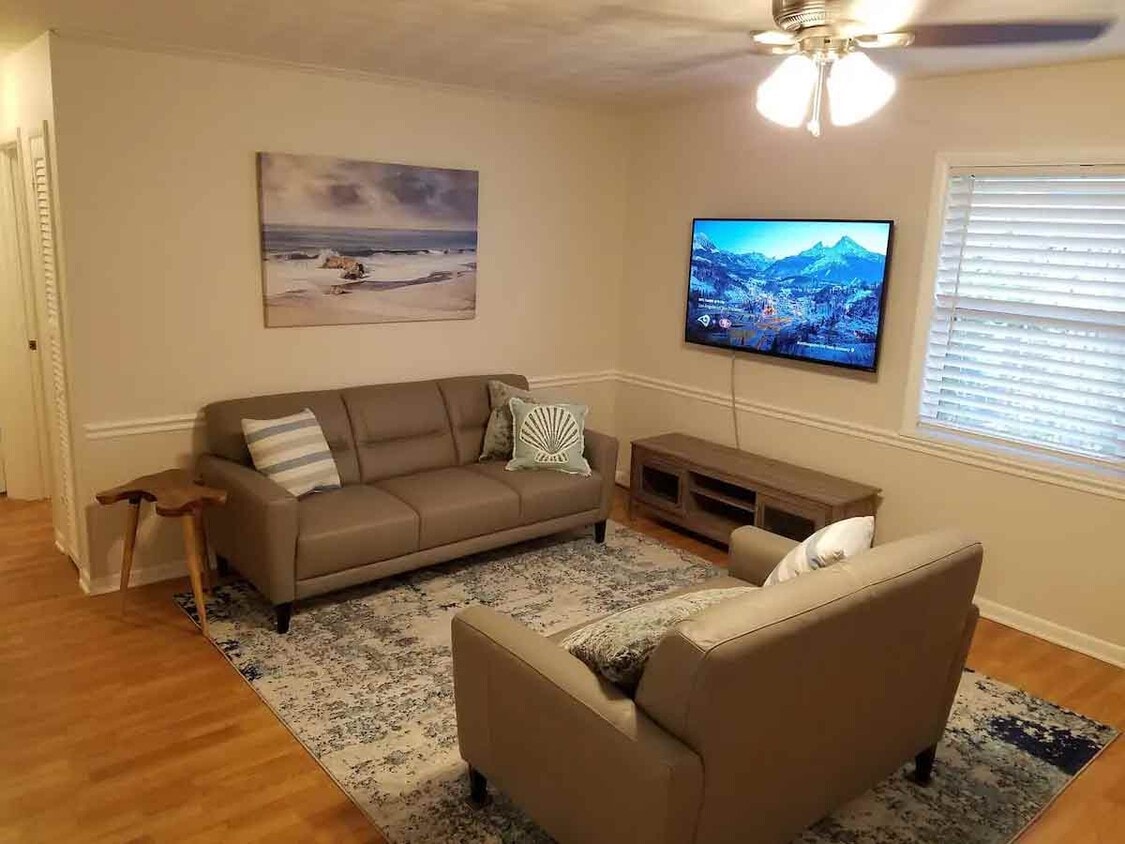 Living room, natuzzi leather couches - 4843 SE Bollard Ave