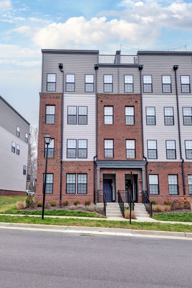 Building Photo - Three Story Brick End Unit with Rooftop Terrace