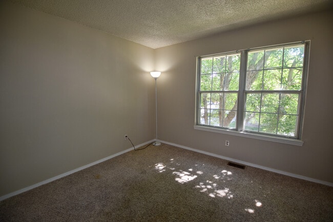 The second bedroom is large and has a large closet. - 3509 Queen Anne Way