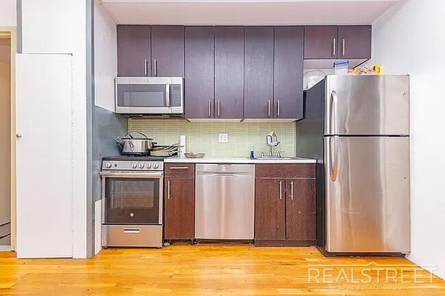 Building Photo - Massive Outdoor Patio | Spacious 3BR/2BA Apartment in Bushwick–East Williamsburg