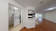 Located at 675 Richmond St in London, Ontario, this one-bedroom, one-bathroom unit offers a well-organized layout across a single floor, making efficient use of its comfortable living space. Warm-toned hardwood flooring flows consistently throughout the main areas, lending a cohesive and inviting character to the unit.

The kitchen is a functional highlight, featuring dark espresso cabinetry, light countertops with a decorative tile backsplash, and a full suite of stainless steel appliances including a range, microwave, dishwasher, and refrigerator. A pass-through counter connects the kitchen to the adjacent living area, enhancing the open feel between the two spaces.

The living room is generously proportioned with large windows that invite natural light and provide views of the surrounding neighbourhood. Crisp white walls and clean baseboards throughout contribute to a bright, neutral aesthetic.

The bedroom is a well-sized private retreat, also finished with hardwood flooring and white walls. A dedicated closet provides practical storage. The bathroom is finished with light ceramic tile flooring, a dark wood vanity with stone-look countertop, and a full tub-shower combination accented by neutral rectangular wall tiles. A hallway connects the rooms, completing the straightforward and functional floor plan.