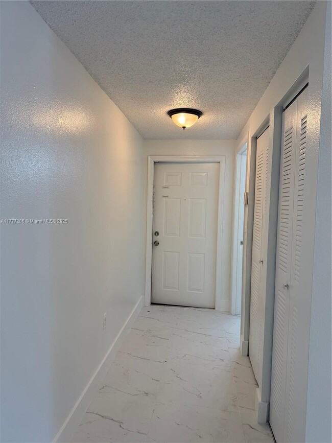 Building Photo - 3221 Sabal Palm Manor