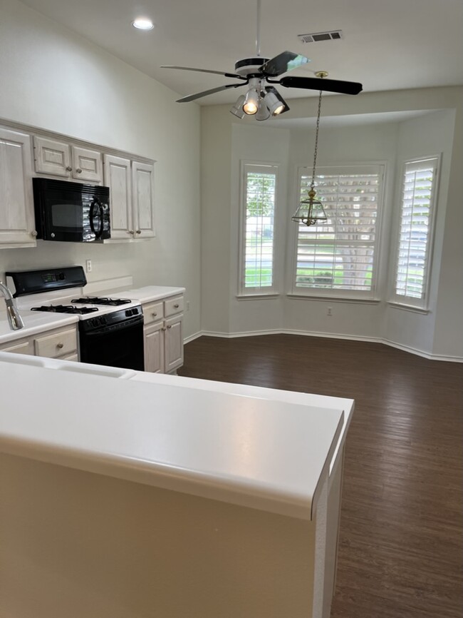 Breakfast area w/wooden shuttered windows - 127 Rain Lily Ln