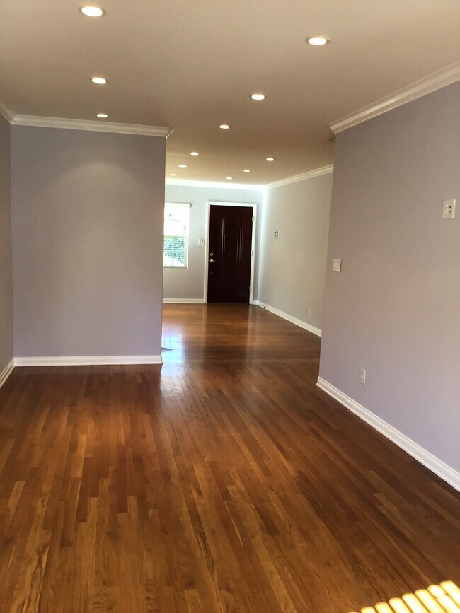 Gleaming wood flooring throughout - 4916 Fulton Ave